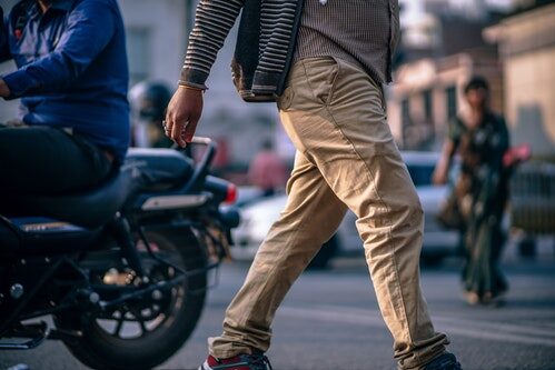 Man wearing mismatched jacket, shirt and pants